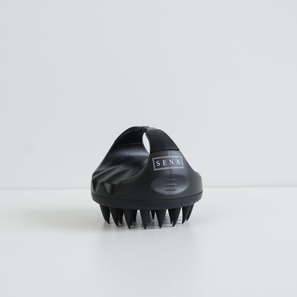 Close-up of SENA scalp brush soft silicone bristles for gentle exfoliation