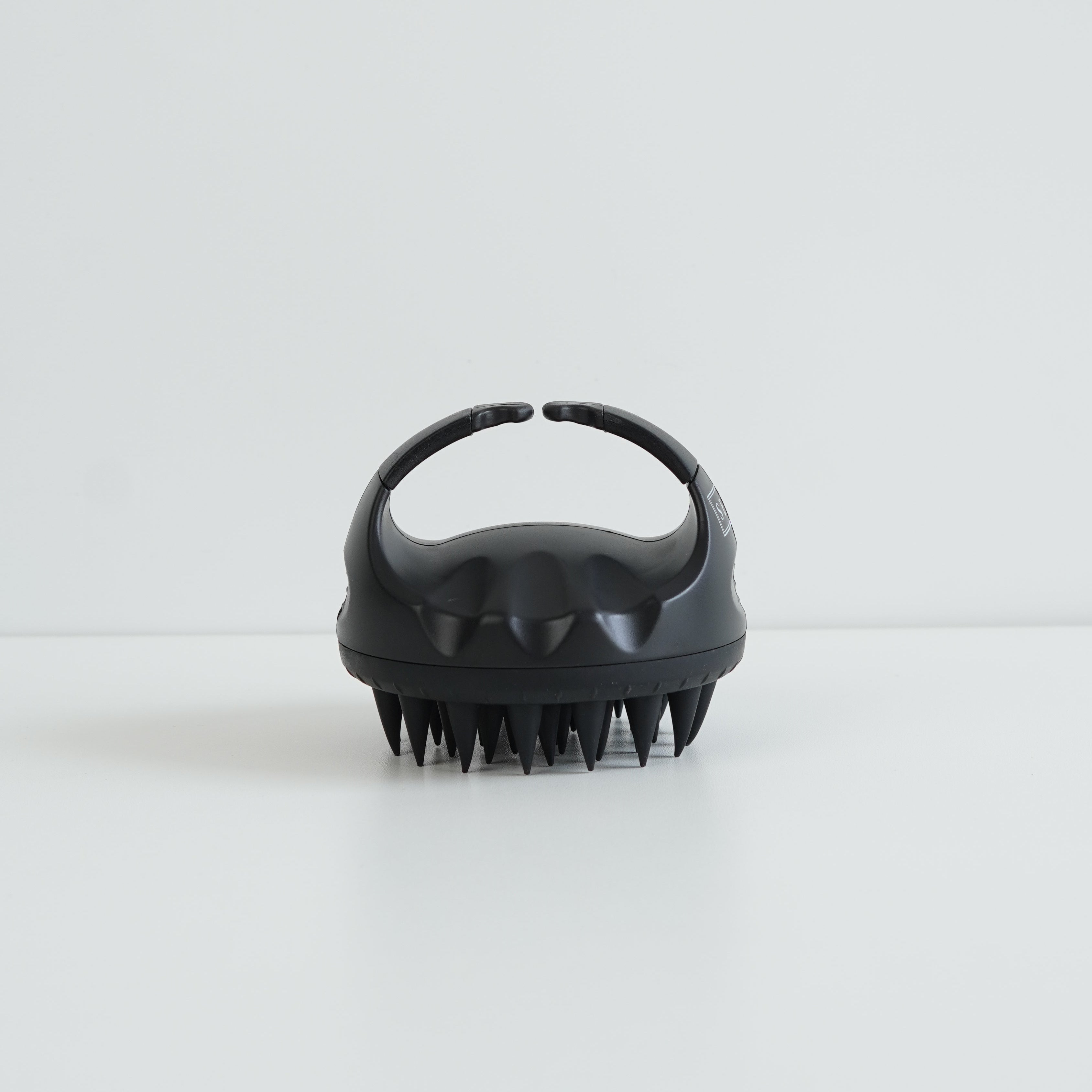 SENA black silicone scalp massager brush for hair growth and relaxation